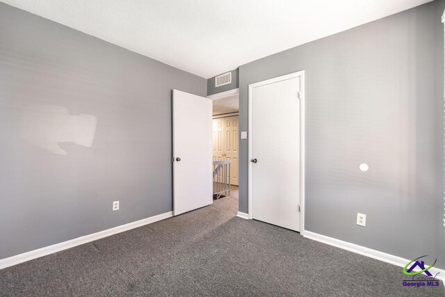 127 Stoneridge Dr, Warner Robins, GA 31088 - unfurnished bedroom featuring carpet flooring, visible vents, and baseboards