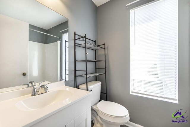 127 Stoneridge Dr, Warner Robins, GA 31088 - full bathroom featuring a shower, plenty of natural light, toilet, and vanity
