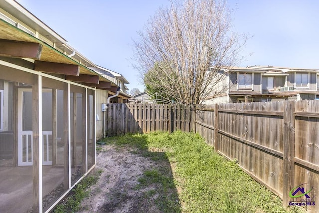 127 Stoneridge Dr, Warner Robins, GA 31088 - view of yard with a fenced backyard and a sunroom