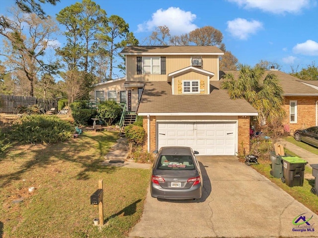 101 Leisure Lake Ct, Warner Robins, GA 31088 - view of front of house featuring a garage, brick siding, driveway, and fence