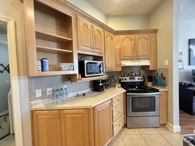 kitchen with light tile patterned flooring, light brown cabinetry, stainless steel appliances, light countertops, and under cabinet range hood