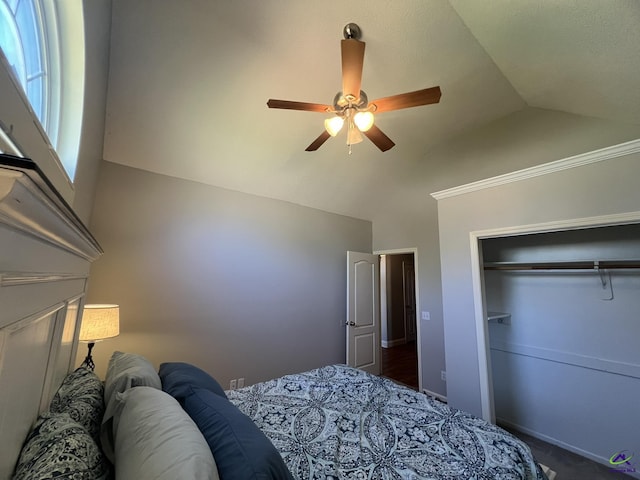 bedroom featuring vaulted ceiling, a ceiling fan, and a closet
