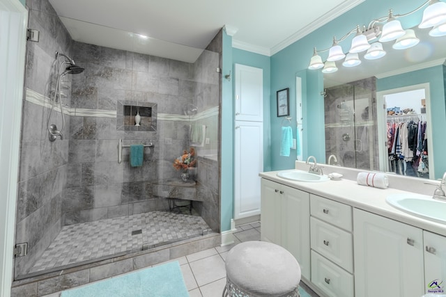 full bath featuring a shower stall, crown molding, double vanity, and a sink