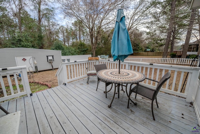wooden terrace featuring fence