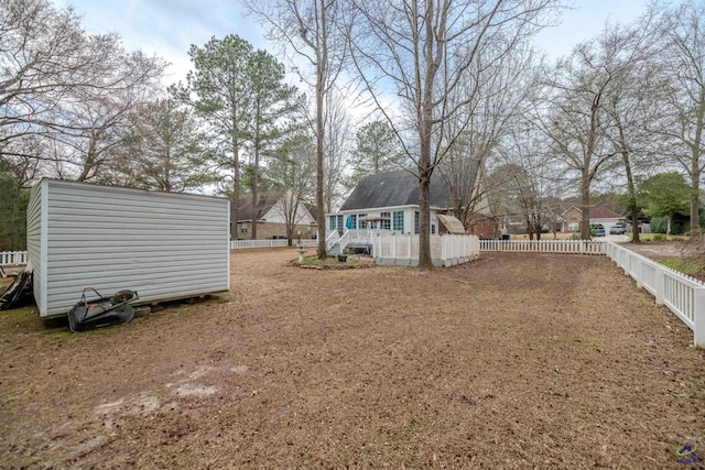 view of yard featuring an outbuilding and a fenced backyard