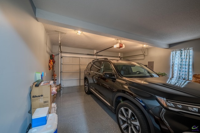 garage featuring electric panel and a garage door opener