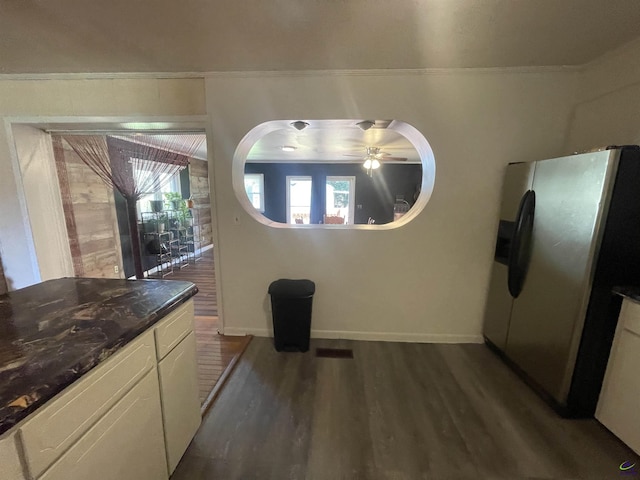 78 Duncan St, Fort Valley, GA 31030 - kitchen with stainless steel fridge with ice dispenser, wood finished floors, ceiling fan, white cabinetry, and dark stone counters