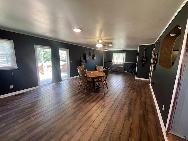 78 Duncan St, Fort Valley, GA 31030 - dining area with ornamental molding, healthy amount of natural light, dark wood finished floors, and ceiling fan