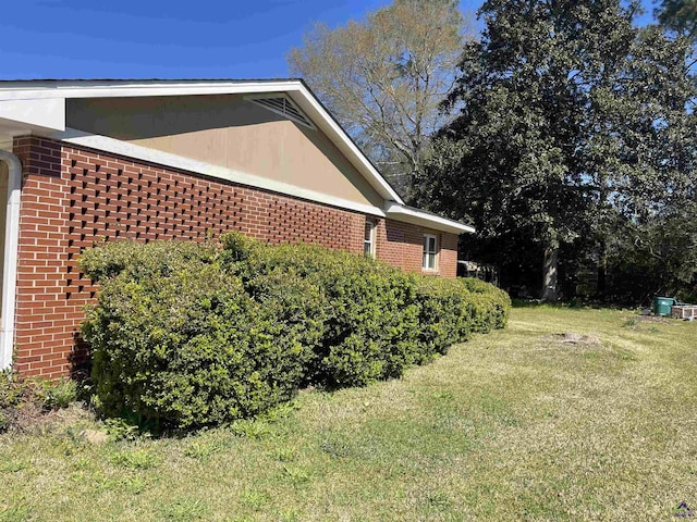 78 Duncan St, Fort Valley, GA 31030 - view of home's exterior featuring brick siding and a lawn