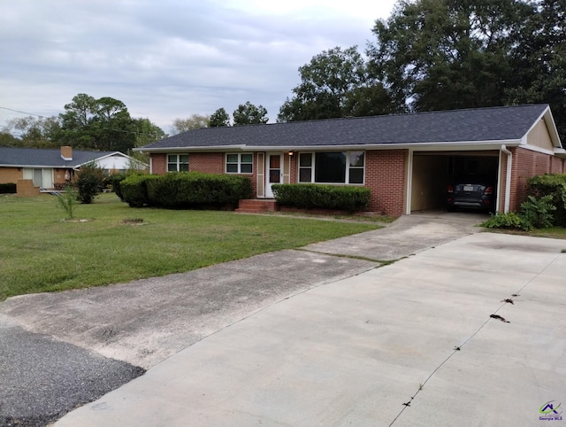 78 Duncan St, Fort Valley, GA 31030 - ranch-style home featuring brick siding, concrete driveway, an attached garage, a front yard, and a shingled roof