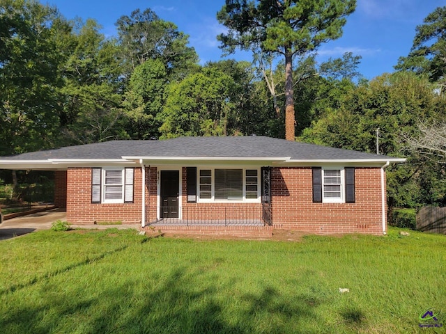 single story home with an attached carport, covered porch, brick siding, and a front yard