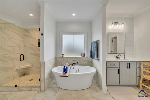 full bathroom with a stall shower, tile walls, a soaking tub, and ornamental molding