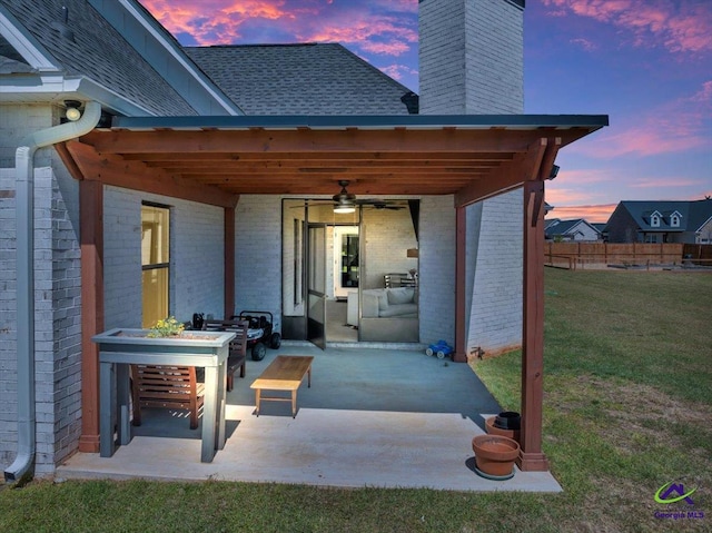view of patio with fence and ceiling fan
