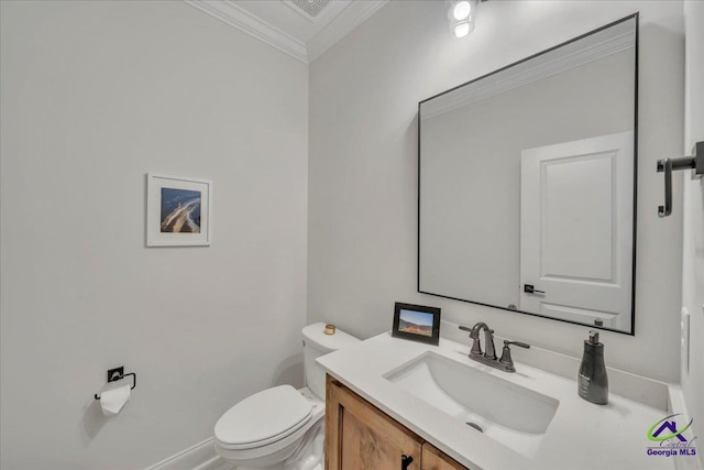 bathroom featuring visible vents, crown molding, toilet, and vanity