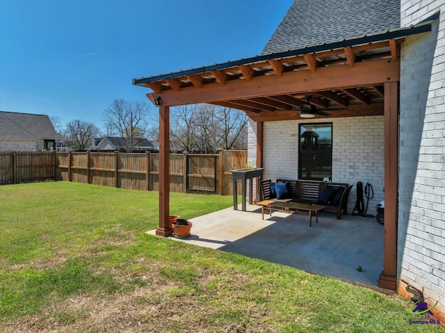 view of yard with a fenced backyard, a patio, and a ceiling fan