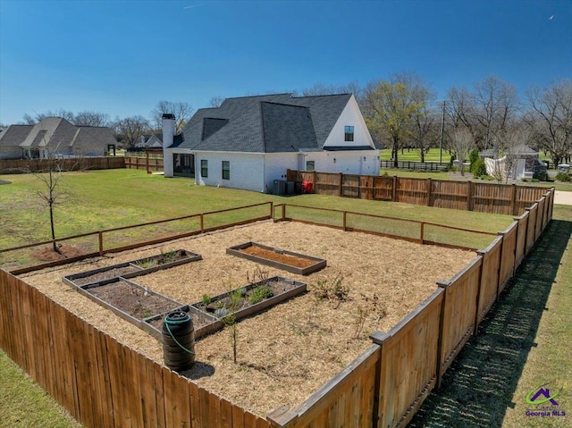 view of yard featuring a garden and fence