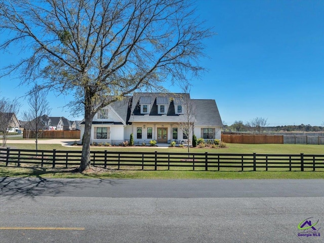 view of front of home featuring a front yard and a fenced front yard
