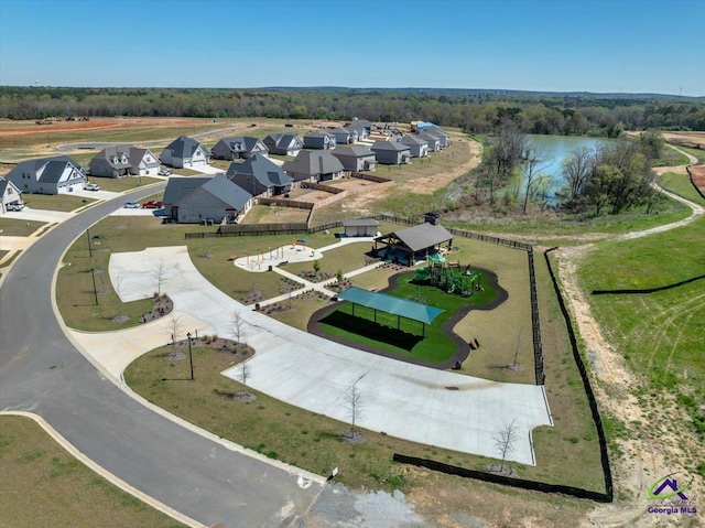 birds eye view of property featuring a water view and a residential view