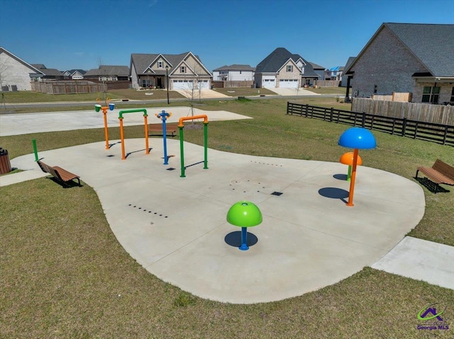 surrounding community with fence, playground community, a yard, and a residential view