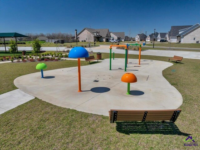 view of play area featuring a residential view and a lawn