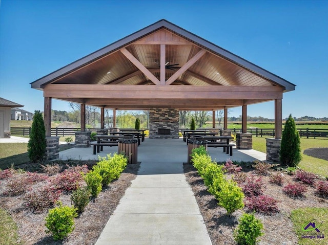 surrounding community featuring a gazebo and fence