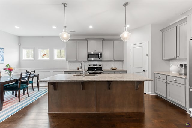 116 Hidesta Ct, Kathleen, GA 31047 - kitchen with dark wood finished floors, a sink, gray cabinets, and appliances with stainless steel finishes