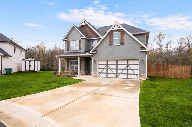 116 Hidesta Ct, Kathleen, GA 31047 - craftsman house with concrete driveway, fence, stone siding, a storage unit, and a garage
