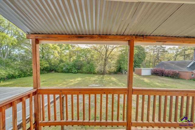 wooden terrace with a yard