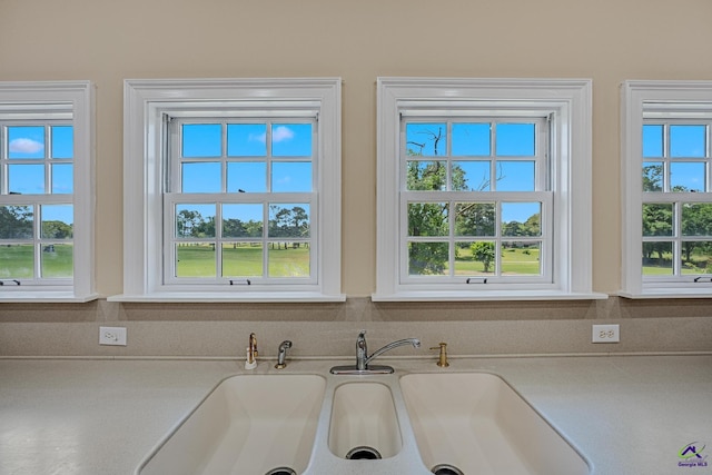 details featuring light countertops and a sink