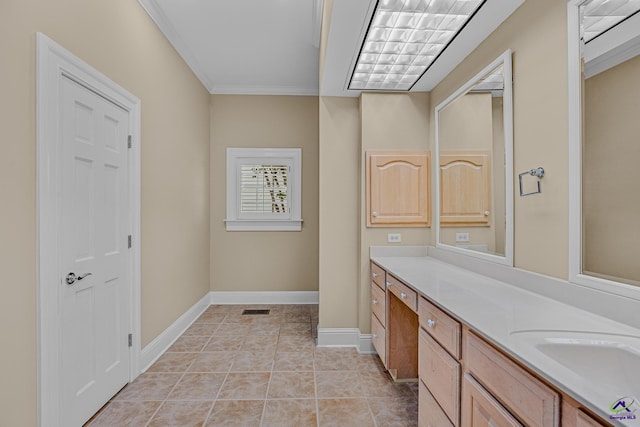 bathroom with tile patterned floors, vanity, baseboards, visible vents, and ornamental molding