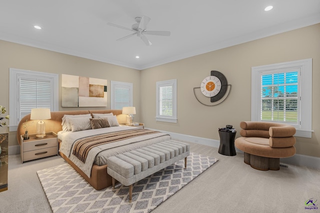 bedroom with ornamental molding, baseboards, and light colored carpet