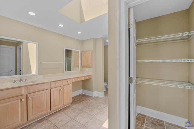 bathroom with tile patterned flooring, vanity, recessed lighting, toilet, and baseboards