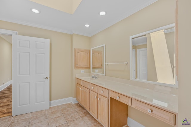 bathroom with baseboards, ornamental molding, recessed lighting, and vanity