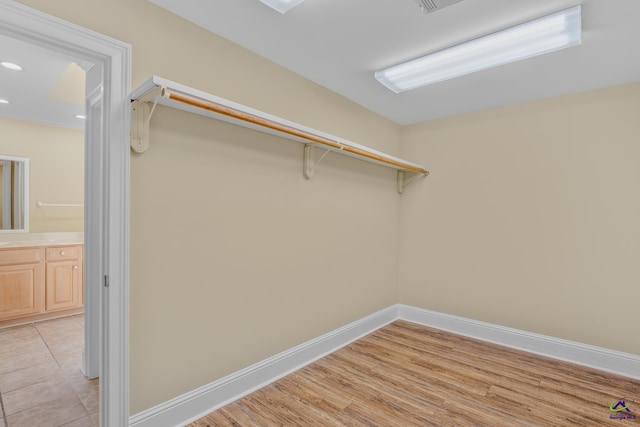spacious closet with light wood-type flooring