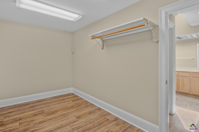 walk in closet featuring light wood-style floors