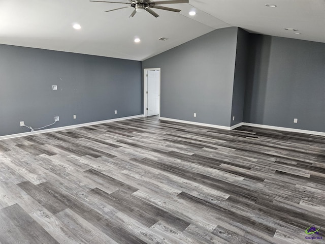 unfurnished room with baseboards, vaulted ceiling, recessed lighting, ceiling fan, and wood finished floors
