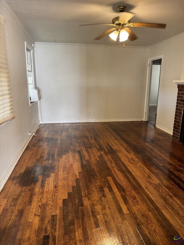 107 Northview Ave, Warner Robins, GA 31088 - spare room with baseboards, a fireplace, ceiling fan, wood finished floors, and ornamental molding