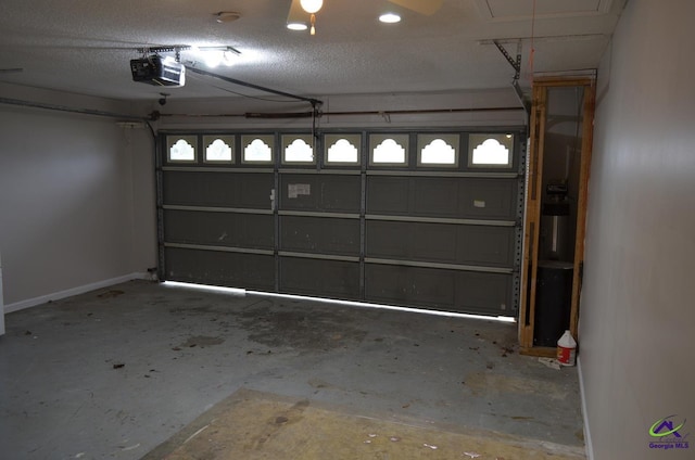 garage with a garage door opener and baseboards