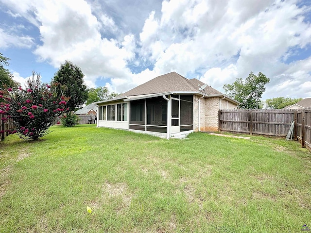 100 Northumberland Way, Warner Robins, GA 31088 - back of house featuring a sunroom, brick siding, and a shingled roof
