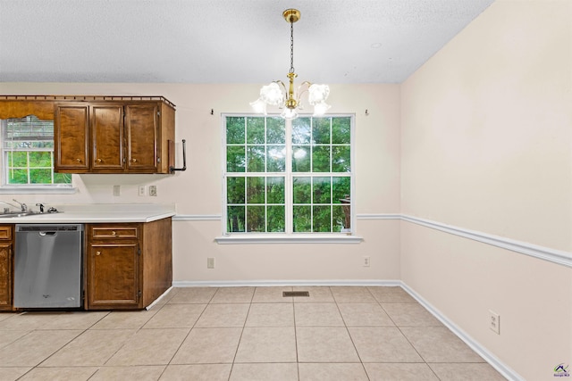kitchen featuring a chandelier, light countertops, decorative light fixtures, visible vents, and dishwasher