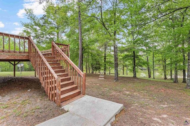 view of yard featuring stairs and a wooden deck