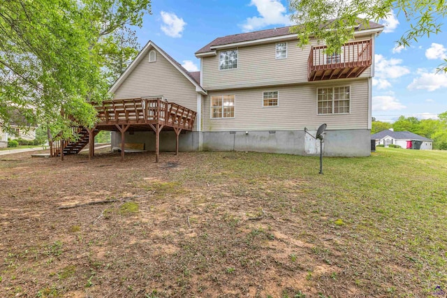 back of house with a wooden deck, stairway, and a lawn