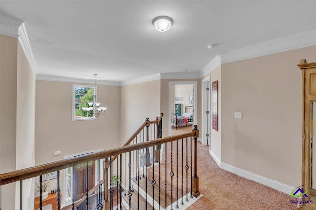 159 Feather Ln, Jackson, GA 30233 - hallway featuring ornamental molding, a chandelier, light carpet, an upstairs landing, and baseboards