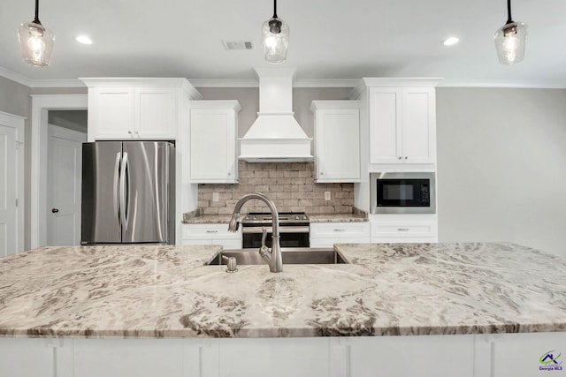 kitchen featuring custom exhaust hood, appliances with stainless steel finishes, backsplash, and white cabinets