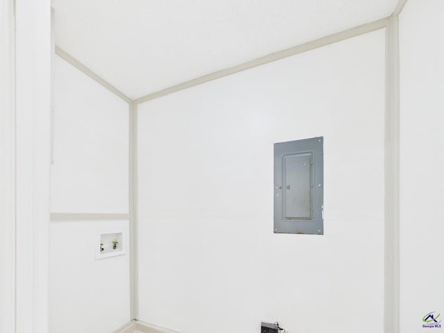 unfurnished room featuring electric panel