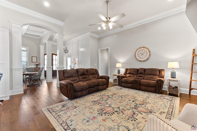 living area featuring a ceiling fan, crown molding, recessed lighting, ornate columns, and wood finished floors