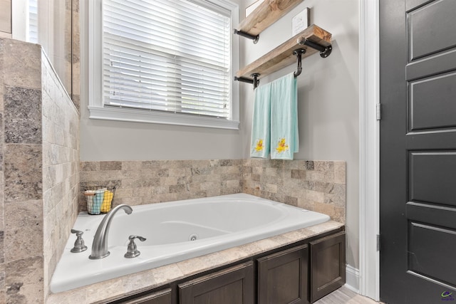 full bathroom with a jetted tub