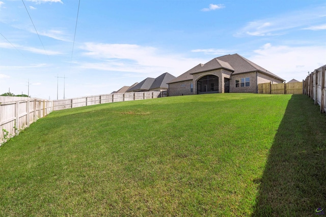 view of yard featuring a fenced backyard