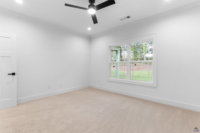 empty room with ornamental molding, light carpet, ceiling fan, recessed lighting, and baseboards