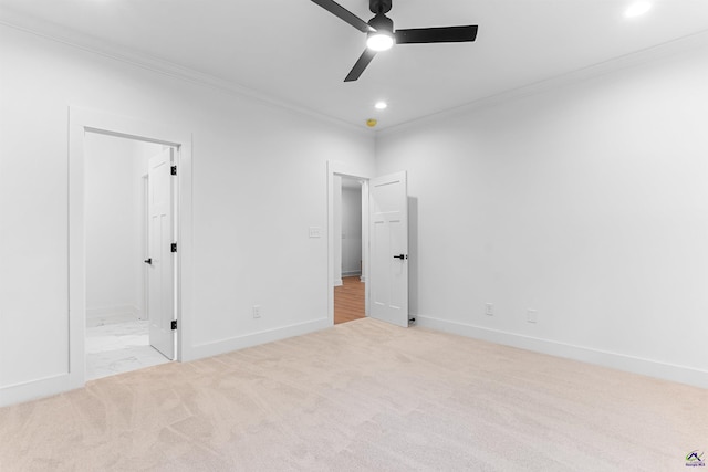 unfurnished bedroom featuring crown molding, carpet, recessed lighting, baseboards, and ensuite bath